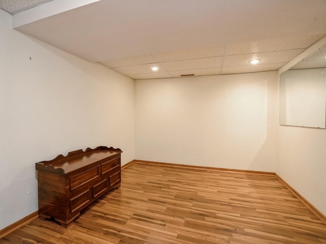 815 W 6th St S, Newton, IA 50208 - empty room featuring light wood-style flooring, a drop ceiling, and recessed lighting