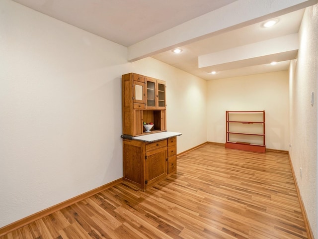 815 W 6th St S, Newton, IA 50208 - spare room with light wood-style flooring, recessed lighting, and beam ceiling