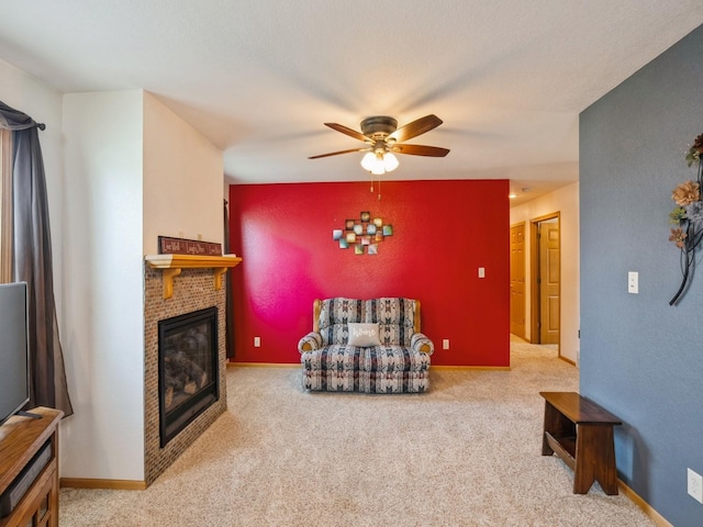 815 W 6th St S, Newton, IA 50208 - carpeted living area featuring a ceiling fan and a fireplace