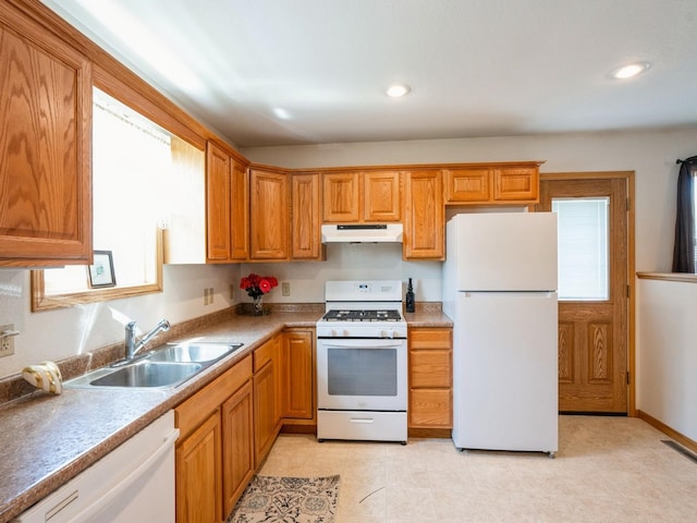 815 W 6th St S, Newton, IA 50208 - kitchen featuring white appliances, under cabinet range hood, recessed lighting, brown cabinetry, and light tile patterned floors