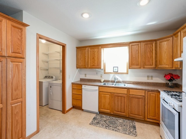 815 W 6th St S, Newton, IA 50208 - kitchen featuring white appliances, independent washer and dryer, brown cabinetry, and recessed lighting