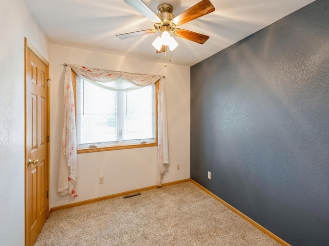815 W 6th St S, Newton, IA 50208 - unfurnished room with light colored carpet and ceiling fan