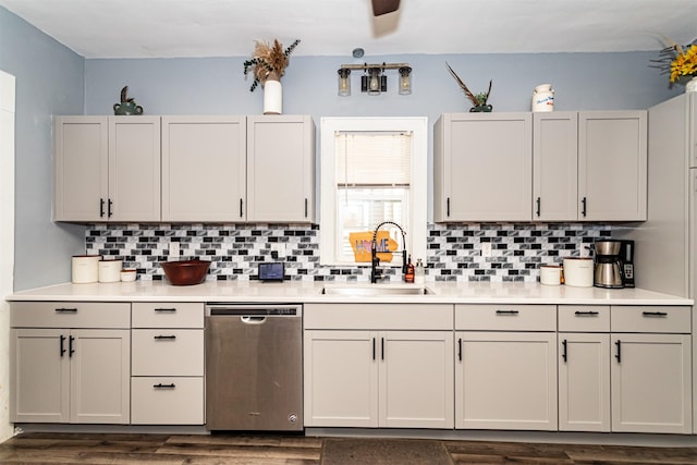 1718 Otley Ave, Perry, IA 50220 - kitchen with dishwasher, tasteful backsplash, light countertops, and dark wood-type flooring