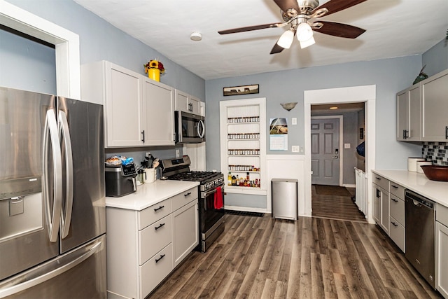 1718 Otley Ave, Perry, IA 50220 - kitchen with appliances with stainless steel finishes, light countertops, a ceiling fan, and dark wood-style floors