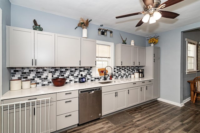 1718 Otley Ave, Perry, IA 50220 - kitchen with dishwasher, ceiling fan, backsplash, dark wood finished floors, and light countertops