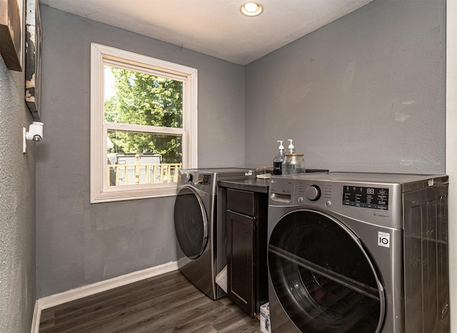 1718 Otley Ave, Perry, IA 50220 - laundry room with dark wood-style floors and washer and clothes dryer