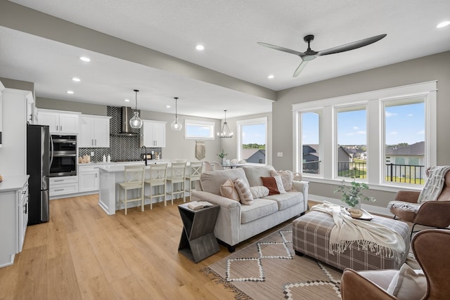 17736 Hammontree Dr, Clive, IA 50325 - living area featuring ceiling fan, light wood-type flooring, and recessed lighting