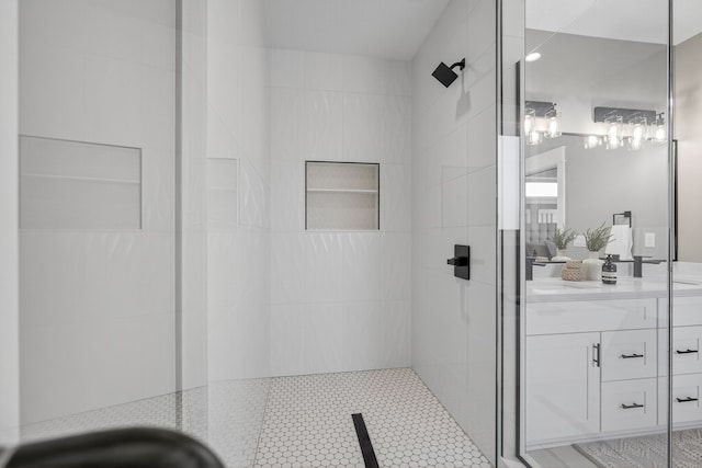 17736 Hammontree Dr, Clive, IA 50325 - bathroom featuring a tile shower, vanity, and tile patterned floors
