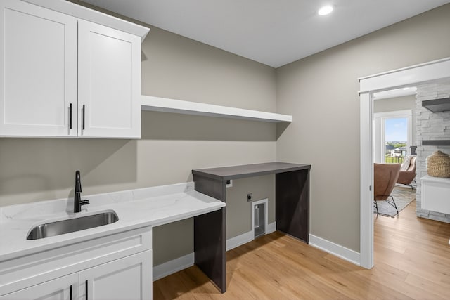 17736 Hammontree Dr, Clive, IA 50325 - laundry area with cabinet space, light wood-style floors, hookup for an electric dryer, and recessed lighting