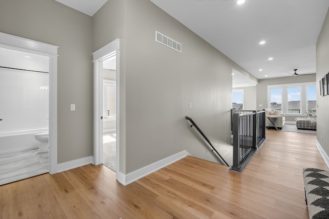 17736 Hammontree Dr, Clive, IA 50325 - hallway featuring an upstairs landing, light wood-style floors, and recessed lighting