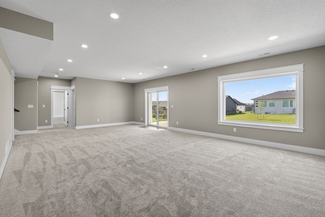 17736 Hammontree Dr, Clive, IA 50325 - spare room with recessed lighting, light colored carpet, and a textured ceiling