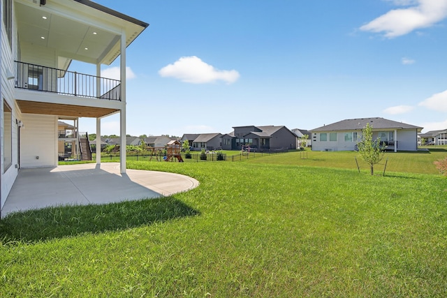 17736 Hammontree Dr, Clive, IA 50325 - view of green lawn featuring a residential view, a patio, stairs, and a playground