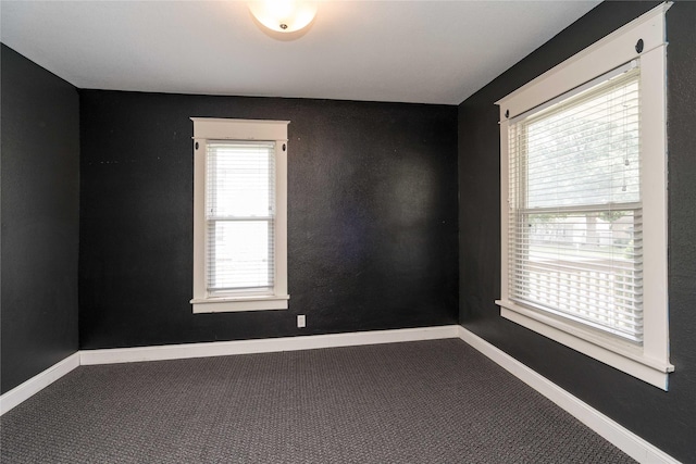 2124 E 23rd St, Des Moines, IA 50317 - carpeted spare room featuring baseboards