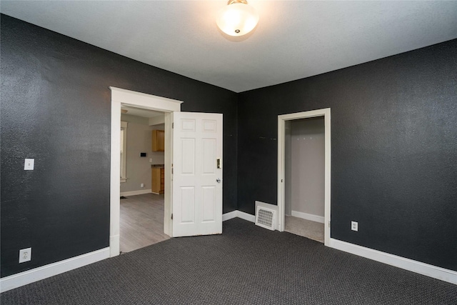 2124 E 23rd St, Des Moines, IA 50317 - empty room featuring carpet floors and baseboards