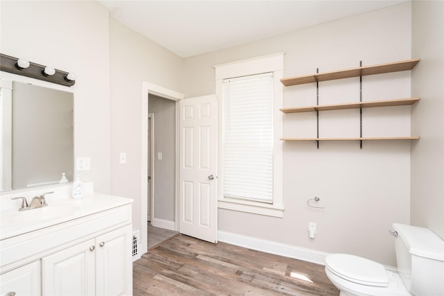 2124 E 23rd St, Des Moines, IA 50317 - bathroom featuring vanity and wood finished floors