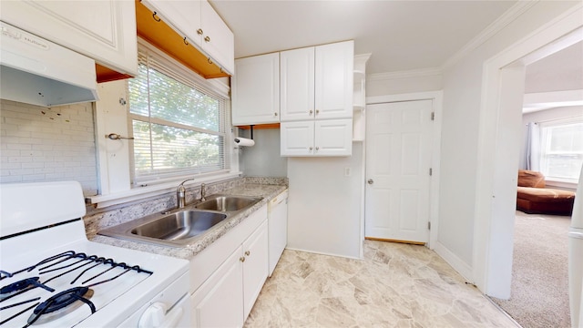 1725 Mondamin Ave, Des Moines, IA 50314 - kitchen with white appliances, light countertops, healthy amount of natural light, white cabinets, and crown molding