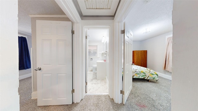 1725 Mondamin Ave, Des Moines, IA 50314 - hall with carpet and a textured ceiling