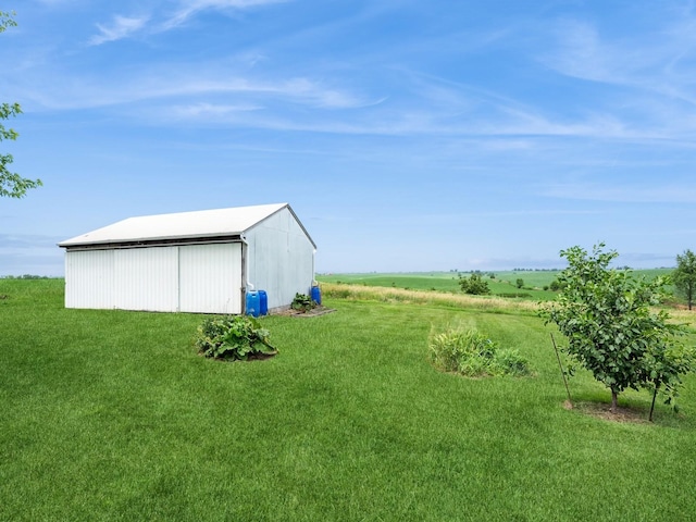 1246 N 75th Ave W, Newton, IA 50208 - view of grassy yard featuring a pole building and an outdoor structure