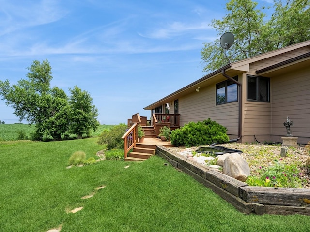 1246 N 75th Ave W, Newton, IA 50208 - view of grassy yard with a wooden deck and stairs