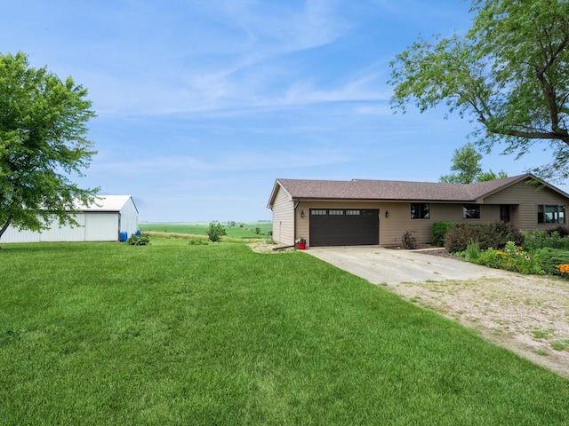 1246 N 75th Ave W, Newton, IA 50208 - view of grassy yard with driveway and an attached garage