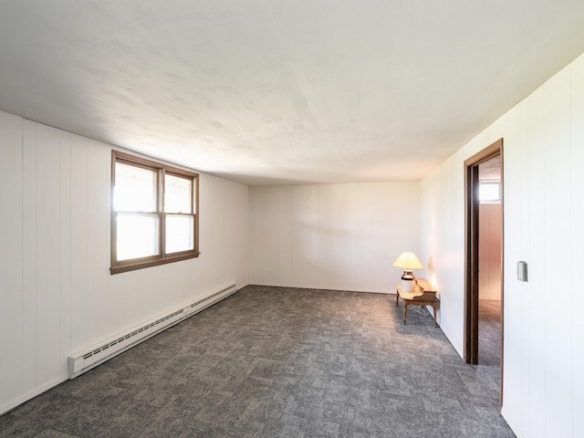 1246 N 75th Ave W, Newton, IA 50208 - carpeted empty room featuring baseboard heating