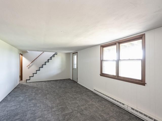 1246 N 75th Ave W, Newton, IA 50208 - basement with a baseboard heating unit, stairway, and carpet