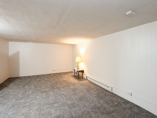 1246 N 75th Ave W, Newton, IA 50208 - spare room featuring carpet floors and baseboard heating