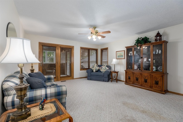 1412 Court St, Adel, IA 50003 - living area featuring carpet floors and ceiling fan