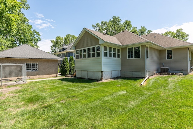 1412 Court St, Adel, IA 50003 - back of house with a yard and roof with shingles
