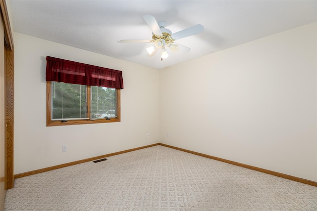 1412 Court St, Adel, IA 50003 - carpeted empty room with a ceiling fan and baseboards