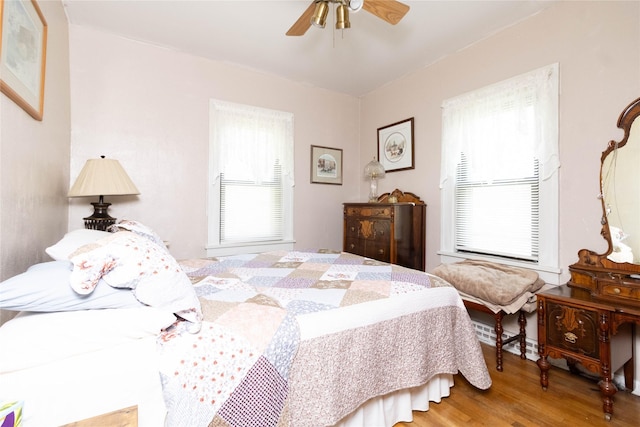 3851 E 25th St, Des Moines, IA 50317 - bedroom with wood finished floors and a ceiling fan