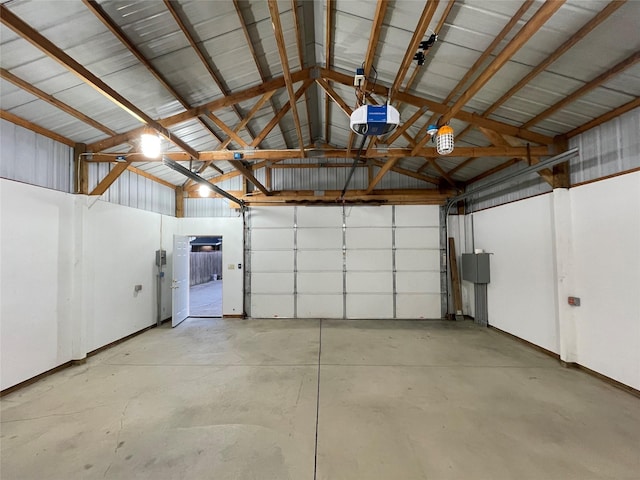 401 NW 50th Pl, Des Moines, IA 50313 - garage with a garage door opener and baseboards