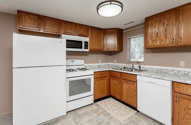 401 NW 50th Pl, Des Moines, IA 50313 - kitchen with white appliances and brown cabinetry