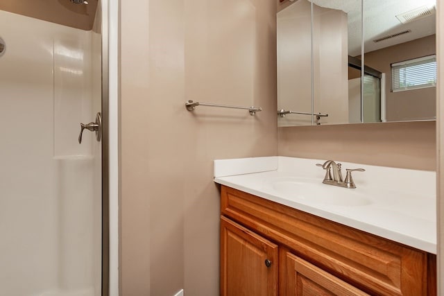 401 NW 50th Pl, Des Moines, IA 50313 - full bathroom featuring a shower stall and vanity
