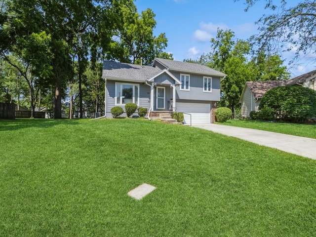 1907 Thornton Ct, Des Moines, IA 50320 - tri-level home with concrete driveway, an attached garage, brick siding, and roof with shingles