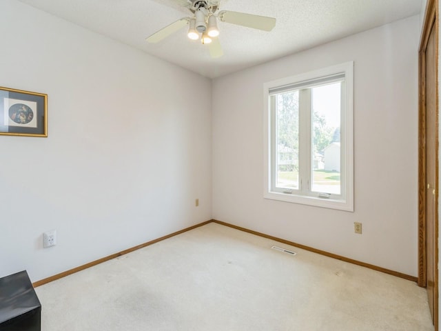 1907 Thornton Ct, Des Moines, IA 50320 - spare room with light colored carpet and ceiling fan