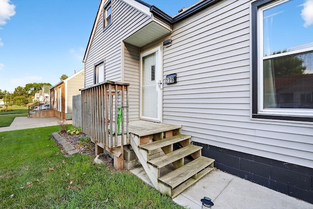 228 Hillside Ave, West Des Moines, IA 50265 - view of exterior entry featuring a lawn