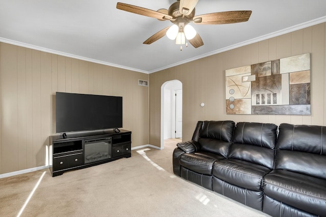 228 Hillside Ave, West Des Moines, IA 50265 - living room with arched walkways, crown molding, carpet flooring, and ceiling fan