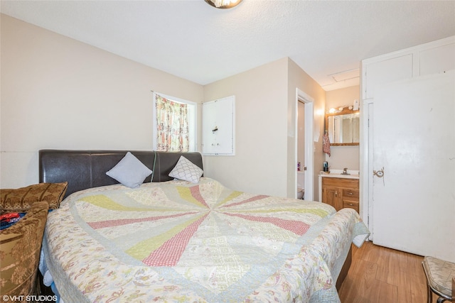 4131 55th St, Des Moines, IA 50310 - bedroom featuring light wood-type flooring and connected bathroom