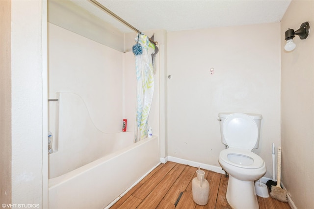 4131 55th St, Des Moines, IA 50310 - bathroom with wood finished floors and shower / bath combination with curtain