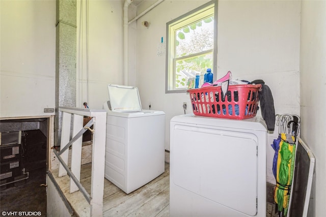 4131 55th St, Des Moines, IA 50310 - laundry area with washing machine and dryer and wood finished floors