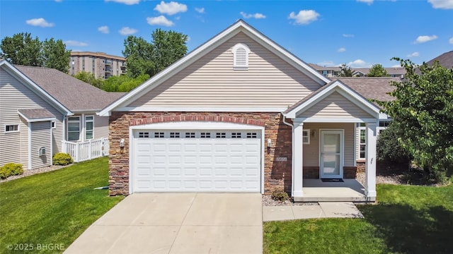 2811 SW Westview Ln, Ankeny, IA 50023 - view of front facade with stone siding, driveway, a front yard, and an attached garage