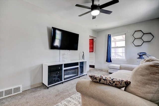 2721 E 16th St, Des Moines, IA 50316 - living area featuring carpet and ceiling fan