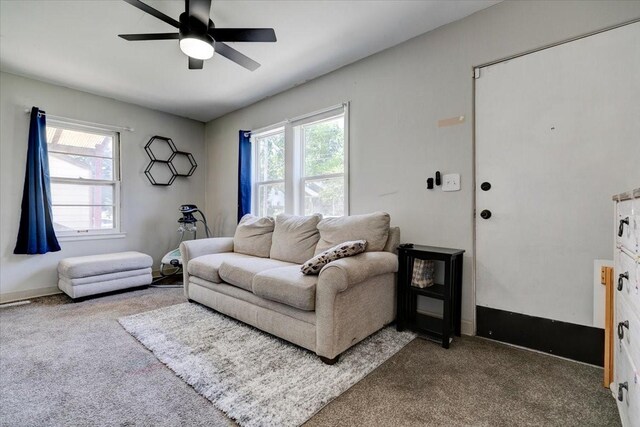 2721 E 16th St, Des Moines, IA 50316 - carpeted living area with ceiling fan and healthy amount of natural light
