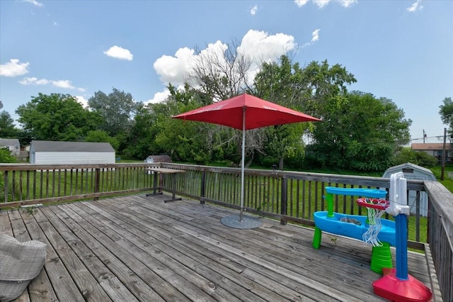 2721 E 16th St, Des Moines, IA 50316 - wooden deck featuring a shed and a lawn