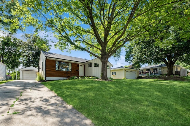 804 24th St, West Des Moines, IA 50265 - single story home with an outbuilding, a detached garage, and a front yard
