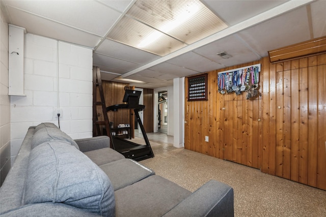 804 24th St, West Des Moines, IA 50265 - living room featuring concrete block wall and wooden walls