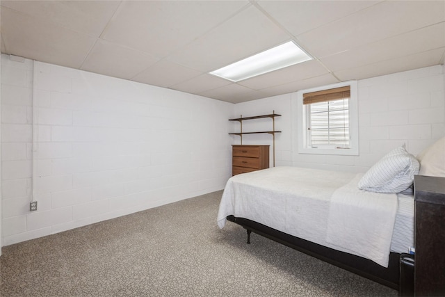 804 24th St, West Des Moines, IA 50265 - bedroom featuring concrete block wall, a paneled ceiling, and carpet