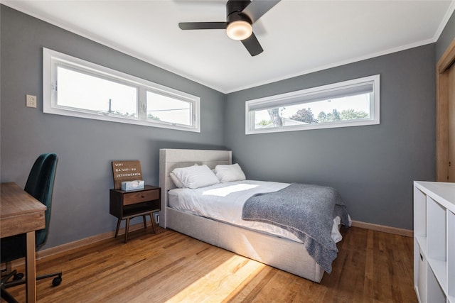 804 24th St, West Des Moines, IA 50265 - bedroom featuring wood finished floors, ornamental molding, a ceiling fan, and an office area