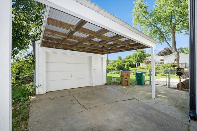 804 24th St, West Des Moines, IA 50265 - garage with a gate and concrete driveway